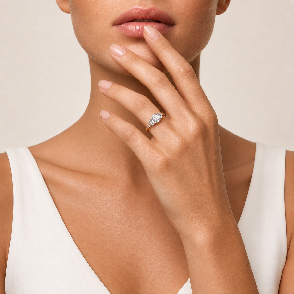 Emerald Cut Three Stone Diamond Ring with Round Accents