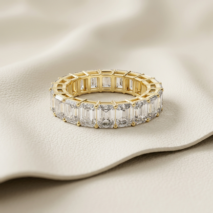 Emerald cut diamond eternity ring close up
Gold eternity ring with baguette diamonds
Luxury emerald cut diamond band ring
Elegant full diamond eternity ring
Premium gold diamond eternity band
Sparkling emerald cut diamond ring
Fine jewelry eternity band design
Stylish baguette diamond ring
Beautiful eternity ring with diamonds
High end diamond eternity band