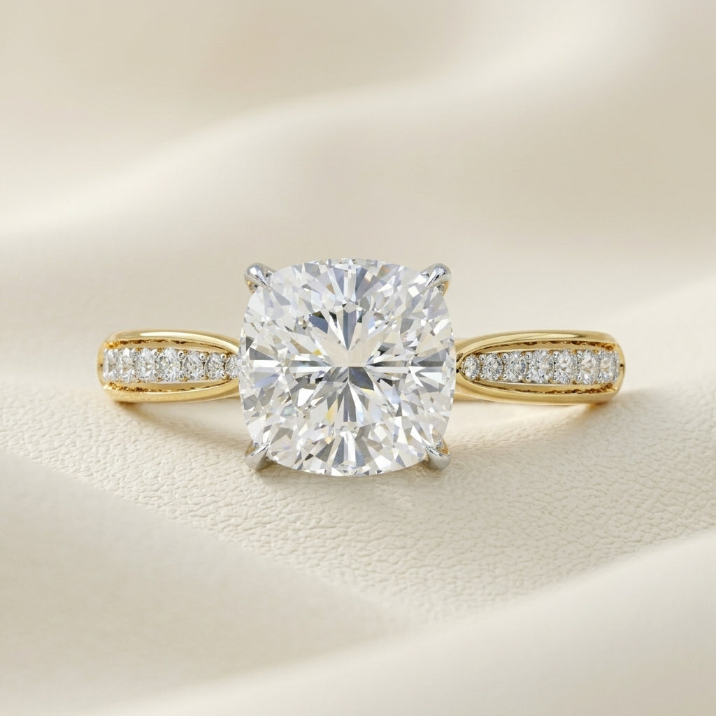 Cushion cut diamond solitaire ring in yellow gold
Cushion cut diamond ring with pavé band
Yellow gold cushion cut diamond engagement ring
Luxury cushion cut solitaire diamond ring
Fine jewelry cushion cut diamond ring
Elegant cushion cut diamond ring with pavé diamonds
Modern yellow gold cushion cut diamond ring
Premium cushion cut diamond ring for women
Handcrafted cushion cut diamond solitaire ring
Contemporary cushion cut diamond ring with pavé band