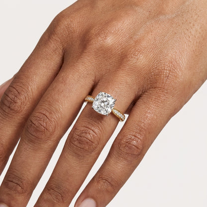 Cushion cut diamond solitaire ring on hand
Cushion cut diamond ring worn on finger
Yellow gold cushion cut diamond ring on hand
Cushion cut diamond ring with pavé band on finger
Luxury cushion cut diamond solitaire ring on hand
Fine jewelry cushion cut diamond ring worn by model
Elegant cushion cut diamond ring close up
Modern yellow gold cushion cut diamond ring on hand
Premium cushion cut diamond ring lifestyle view
Hand wearing cushion cut diamond solitaire ring