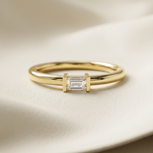 Emerald cut solitaire diamond ring in yellow gold
Minimalist emerald cut diamond engagement ring
Yellow gold emerald cut bezel style diamond ring
Elegant emerald cut solitaire ring close-up
Fine jewelry emerald cut diamond ring for women
Classic emerald cut diamond engagement ring
Modern yellow gold emerald cut solitaire ring
Delicate emerald cut diamond ring product photo
Luxury emerald cut diamond ring with slim band
Timeless emerald cut solitaire engagement ring