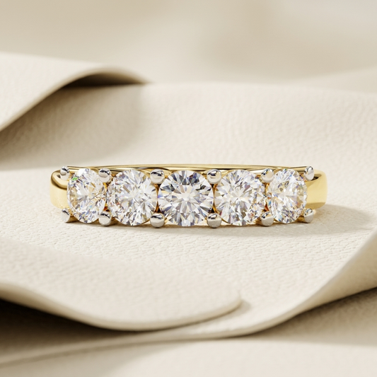 Yellow gold band with five brilliant round diamonds
Graduated round diamonds aligned across a polished gold band
Elegant five stone diamond band with prominent center setting
Brilliant diamond row featuring balanced graduated stone sizes
Classic gold band showcasing five closely arranged round diamonds
Radiant five diamond design with secure prong set details
Fine jewelry band featuring a bold graduated diamond sequence
Polished yellow gold band with luminous round cut stone arrangement
Refined diamond band