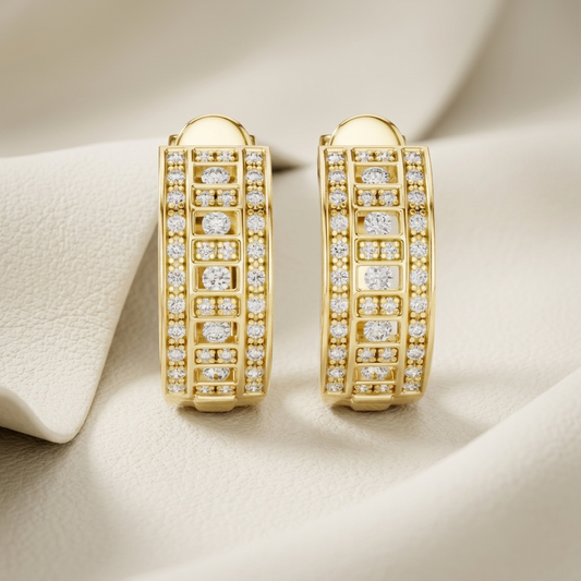 Yellow gold geometric hoop earrings featuring brilliant round diamonds and openwork detailing.
Elegant geometric diamond hoop earrings crafted in polished yellow gold.
Luxury yellow gold hoop earrings with sparkling diamond rows and a modern pattern.
Fine jewelry geometric earrings adorned with brilliant pavé and bezel-set diamonds.
Contemporary yellow gold diamond hoop earrings with an intricate geometric design.
Premium gold hoop earrings showcasing radiant diamonds in a structured openwork style.
Designe
