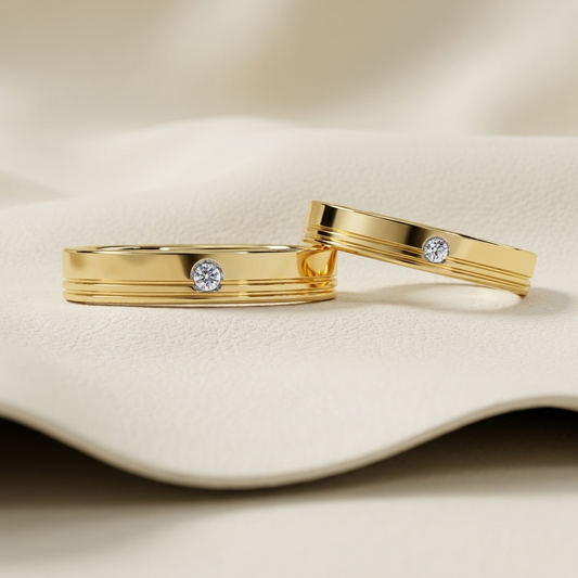 Yellow gold grooved bezel solitaire diamond wedding band rings
Elegant yellow gold wedding bands with bezel set round diamonds
Luxury polished gold band rings featuring center solitaire diamonds
Fine jewelry grooved wedding band rings with minimalist design
Contemporary yellow gold bezel diamond band rings
Premium classic gold wedding bands with round brilliant diamonds
Designer grooved bezel solitaire band rings close up
Stylish yellow gold wedding rings with sleek engraved grooves
Modern polished gold dia