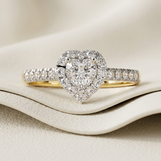 Yellow gold heart cut diamond ring with sparkling halo
Brilliant heart shaped center diamond surrounded by pavé stones
Elegant heart diamond engagement ring with detailed band accents
Luxury halo ring featuring a radiant heart shaped diamond
Fine jewelry yellow gold ring with heart diamond centerpiece
Sparkling pavé band ring centered with a brilliant heart diamond
Romantic heart shaped diamond ring with shimmering halo setting
Exquisite diamond halo ring featuring a heart cut center stone
Glamorous yellow 