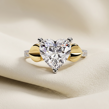 Yellow gold heart cut solitaire diamond bypass engagement ring
Elegant heart shaped diamond ring with bypass band design
Luxury yellow gold heart solitaire engagement ring with pavé shoulders
Fine jewelry heart cut diamond bypass ring in yellow gold
Contemporary heart shaped solitaire ring with polished gold bypass setting
Premium heart diamond engagement ring with pavé accent band
Designer heart cut solitaire bypass diamond ring close up
Romantic yellow gold heart diamond ring with modern bypass style
Styl