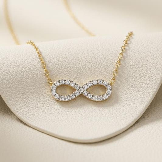 Yellow gold infinity diamond pendant necklace
Luxury infinity symbol diamond necklace in yellow gold
Elegant pavé diamond infinity pendant with gold chain
Fine jewelry infinity diamond necklace close up
Sparkling infinity pendant featuring round brilliant diamonds
Premium yellow gold diamond infinity necklace for women
Designer infinity symbol pendant with pavé diamond setting
Modern infinity diamond pendant necklace in yellow gold
Timeless infinity symbol diamond necklace with delicate chain
Classic yellow
