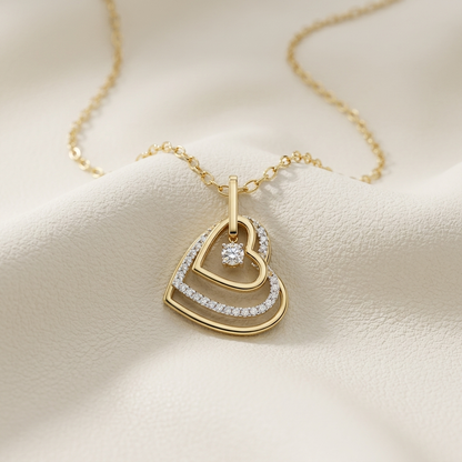 Yellow gold layered open heart diamond pendant necklace
Elegant layered heart pendant with floating round diamond
Luxury yellow gold open heart necklace with pavé diamond accents
Fine jewelry layered heart diamond pendant on delicate gold chain
Contemporary open heart pendant with suspended round brilliant diamond
Premium yellow gold layered heart necklace with sparkling diamond details
Designer open heart diamond pendant close up
Romantic layered heart necklace with floating solitaire diamond
Stylish yello