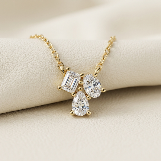 Yellow gold mixed shape diamond pendant necklace
Luxury emerald oval and pear diamond pendant in yellow gold
Elegant three stone mixed cut diamond necklace
Fine jewelry mixed shape diamond pendant close up
Sparkling emerald cut oval and pear diamond pendant
Premium yellow gold pendant with mixed cut diamonds
Designer three stone diamond pendant with emerald oval and pear cuts
Modern mixed shape diamond necklace for women
Timeless yellow gold mixed cut diamond pendant necklace
Classic three stone diamond pen
