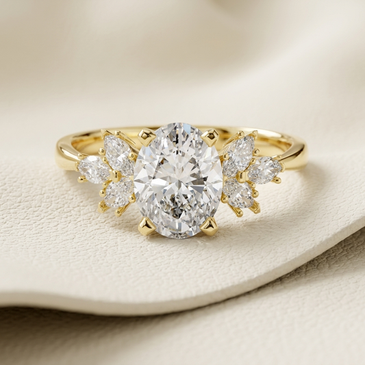 Oval diamond floral ring
Floral cluster diamond ring
Yellow gold oval ring
Oval diamond engagement ring
Gold floral diamond ring
Oval cut diamond ring
Nature inspired diamond ring
Luxury floral engagement ring
Three stone floral ring
Oval diamond gold ring