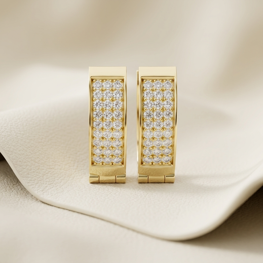 Yellow gold hoop earrings featuring multiple rows of brilliant pavé-set diamonds.
Elegant gold diamond hoop earrings with a sleek rectangular silhouette.
Luxury yellow gold earrings adorned with sparkling round pavé diamonds.
Contemporary diamond hoop earrings crafted in polished yellow gold.
Fine jewelry gold hoops showcasing brilliant pavé diamond detailing.
Premium yellow gold earrings with a modern diamond-studded design.
Stylish gold hoop earrings featuring dazzling diamonds for everyday elegance.
Hand