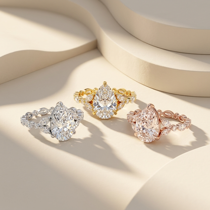 Pear cut diamond engagement rings in three gold colors
White yellow and rose gold pear diamond ring collection
Luxury pear cut diamond rings with marquise side stones
Three metal pear diamond engagement ring comparison
Premium pear cut diamond ring collection display
Bridal pear cut diamond rings in white yellow and rose gold
Pear cut solitaire diamond rings with decorative bands
Fine jewelry pear diamond ring trio lifestyle image
Elegant pear cut engagement rings in multiple metal finishes
Designer pear cu