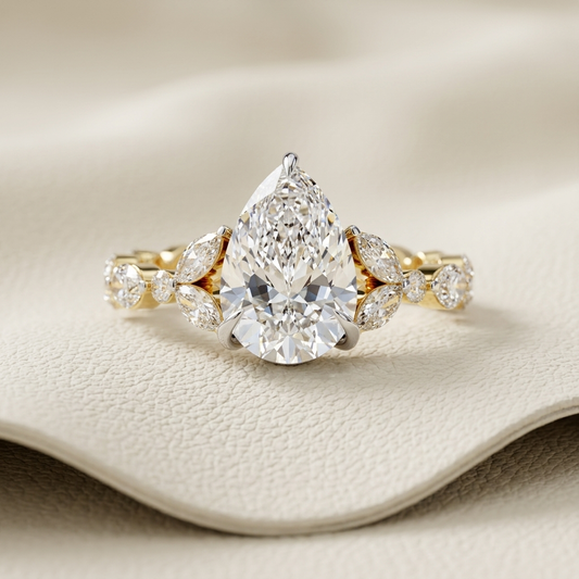 Pear cut diamond solitaire ring in yellow gold
Pear cut diamond ring with marquise diamond band
Luxury pear cut diamond solitaire ring
Fine jewelry pear cut diamond ring for women
Elegant yellow gold pear cut diamond ring
Pear cut diamond ring with marquise side diamonds
Premium pear cut diamond engagement style ring
Modern pear cut diamond solitaire ring
Handcrafted pear cut diamond ring with diamond band
Contemporary pear cut diamond ring with marquise accents