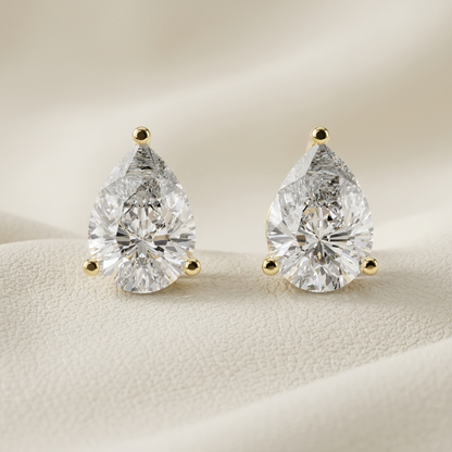 Yellow gold pear diamond stud earrings featuring brilliant pear-shaped solitaire diamonds.
Elegant pear-shaped diamond stud earrings crafted in polished yellow gold.
Luxury yellow gold pear diamond earrings with a classic three-prong setting.
Fine jewelry pear diamond stud earrings showcasing brilliant pear-cut diamonds.
Contemporary yellow gold pear solitaire diamond earrings with timeless elegance.
Premium pear-cut diamond stud earrings designed in polished yellow gold.
Designer yellow gold pear diamond e