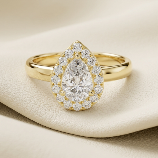 Pear halo diamond ring in yellow gold.
Yellow gold pear halo ring.
Pear diamond halo engagement ring.
Pear solitaire halo diamond ring.
Classic pear halo diamond ring.
Pavé pear halo gold ring.
Elegant pear diamond ring.
Pear cut diamond halo ring.
Luxury pear halo engagement ring.
Gold pear diamond halo ring.