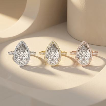 Pear halo solitaire rings in three gold tones.
Pear halo diamond rings in white, yellow, and rose gold.
Pear halo solitaire ring collection.
Triple gold pear halo diamond rings.
Pear engagement rings in three finishes.
Elegant pear halo diamond rings.
Luxury pear halo solitaire rings.
Pear-shaped halo rings in three gold colors.
Classic pear halo engagement ring collection.
Pear cut diamond halo ring collection.