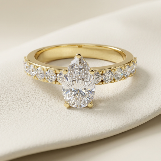 Pear solitaire diamond ring in yellow gold.
Yellow gold pear diamond ring.
Pear diamond engagement ring.
Pear cut solitaire ring.
Classic pear diamond ring.
Pavé pear diamond ring.
Elegant pear solitaire ring.
Pear diamond gold ring.
Luxury pear engagement ring.
Gold pear solitaire diamond ring.