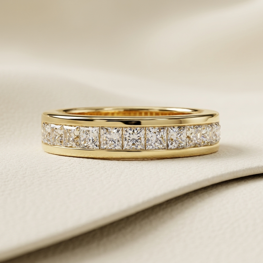 Yellow gold band with channel set princess cut diamonds
Square diamonds aligned across a polished gold band
Elegant diamond band featuring a continuous princess cut row
Brilliant geometric diamonds secured within sleek gold borders
Refined yellow gold band showcasing closely arranged square stones
Modern diamond band with structured channel setting details
Fine jewelry band featuring luminous princess shaped diamond accents
Polished gold band with a symmetrical square diamond sequence
Sophisticated channel 