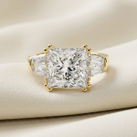 Princess cut diamond in yellow gold.
Three stone princess cut diamond.
Princess diamond with side stones.
Yellow gold princess diamond.
Classic princess cut diamond.
Luxury princess cut diamond.
Princess cut three stone setting.
Brilliant princess cut diamond.
Princess diamond with tapered sides.
Elegant princess cut diamond.