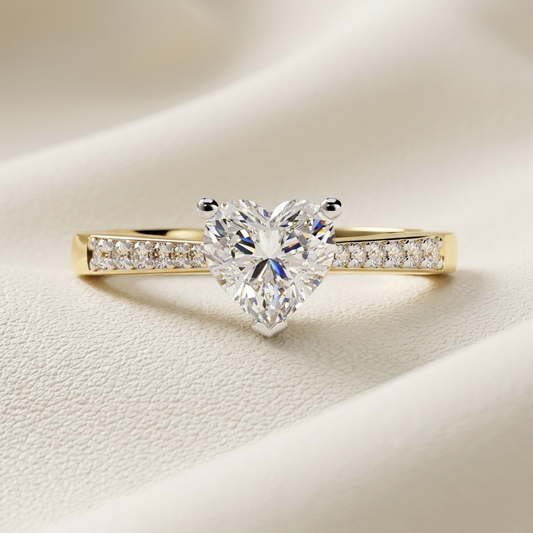Yellow gold heart diamond ring with pavé accented band
Brilliant heart cut center diamond secured in a three prong setting
Elegant solitaire heart diamond ring with sparkling side stones
Luxury yellow gold ring featuring a radiant heart shaped diamond
Refined heart diamond ring with channel style pavé detailing
Fine jewelry ring centered with a dazzling heart cut stone
Sleek yellow gold diamond band with romantic heart centerpiece
Luminous heart shaped diamond ring with delicate band accents
Contemporary he