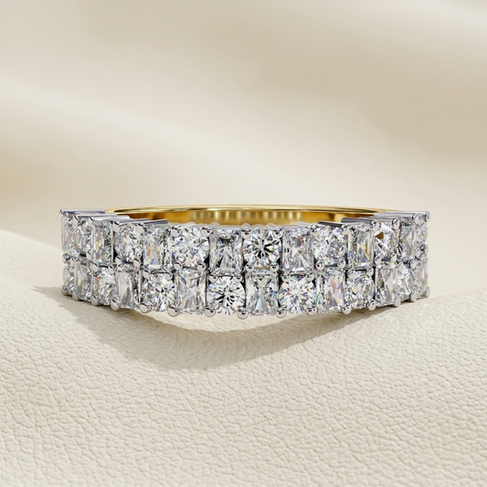 Yellow gold band with two rows of radiant cut diamonds
Brilliant rectangular diamonds arranged in a bold double row setting
Wide diamond band featuring closely aligned geometric stones
Radiant cut diamonds showcased across a structured two tier design
Statement gold band with dense rectangular diamond arrangement
Fine jewelry band featuring layered brilliant diamond panels
Sparkling double row band with uniform elongated stone settings
Contemporary diamond band showcasing a luminous mosaic pattern
Wide yell
