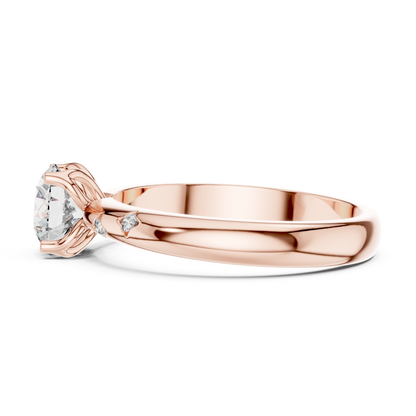 Rose gold round diamond solitaire ring side view
Rose gold engagement ring with round diamond
Delicate rose gold diamond ring profile angle
Round cut diamond ring in rose gold setting
Rose gold solitaire ring with accent details
Polished rose gold ring with center diamond
Fine jewelry rose gold engagement ring
Rose gold diamond ring with decorative band
Elegant rose gold round diamond ring close up
Rose gold solitaire ring with side stone accents