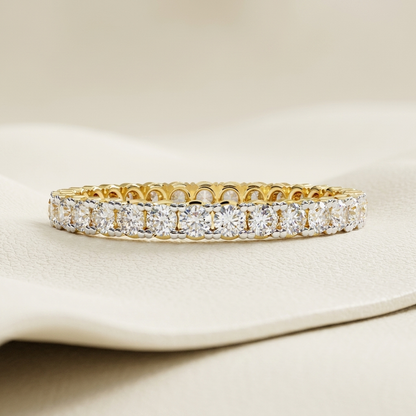 Yellow gold band with continuous round diamond row
Brilliant round diamonds aligned across a classic eternity band
Elegant gold band featuring closely set circular diamonds
Sparkling diamond band with uninterrupted stone arrangement
Refined yellow gold band showcasing a full line of brilliant stones
Fine jewelry band with repeating round cut diamond settings
Radiant diamond band featuring symmetrical continuous sparkle
Classic eternity style band with luminous round diamond accents
Polished gold band adorne