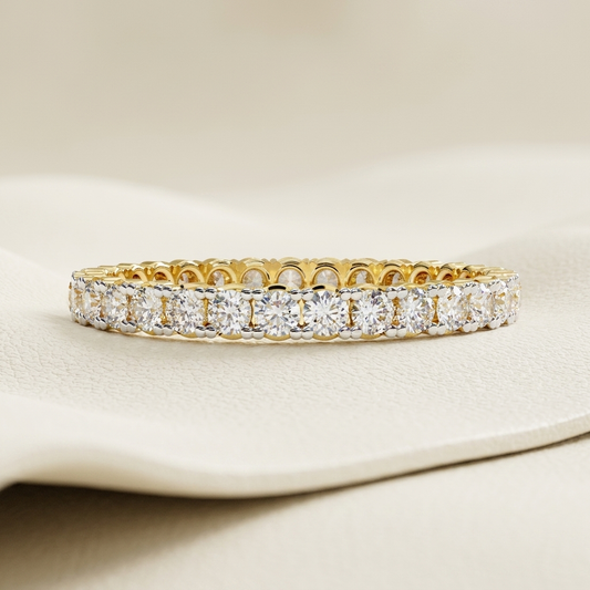 Yellow gold band with continuous round diamond row
Brilliant round diamonds aligned across a classic eternity band
Elegant gold band featuring closely set circular diamonds
Sparkling diamond band with uninterrupted stone arrangement
Refined yellow gold band showcasing a full line of brilliant stones
Fine jewelry band with repeating round cut diamond settings
Radiant diamond band featuring symmetrical continuous sparkle
Classic eternity style band with luminous round diamond accents
Polished gold band adorne