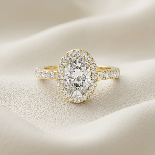 Oval halo diamond ring in yellow gold.
Yellow gold oval halo engagement ring.
Oval diamond ring with halo setting.
Oval cut halo diamond ring.
Pavé band oval halo ring.
Classic oval halo engagement ring.
Oval diamond halo ring in gold.
Elegant oval halo diamond ring.
Luxury oval halo ring.
Oval diamond ring with pavé band.
