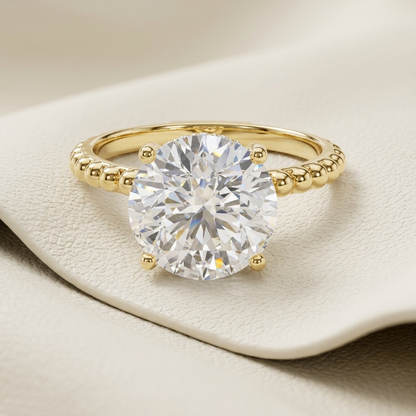 Round solitaire gold ring
Beaded gold diamond ring
Yellow gold solitaire ring
Round diamond engagement ring
Gold beaded band ring
Classic solitaire diamond ring
Elegant gold diamond ring
Luxury solitaire ring
Gold ring with round diamond
Beaded engagement ring