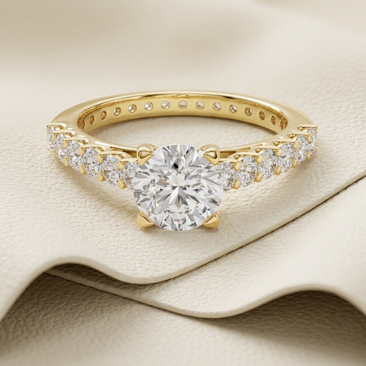 Round solitaire pavé diamond ring.
Yellow gold pavé diamond ring.
Round diamond ring with pavé band.
Classic pavé solitaire ring.
Elegant round diamond ring.
Round engagement ring in yellow gold.
Pavé band solitaire diamond ring.
Gold round diamond ring.
Luxury round solitaire ring.
Round diamond ring with side stones.