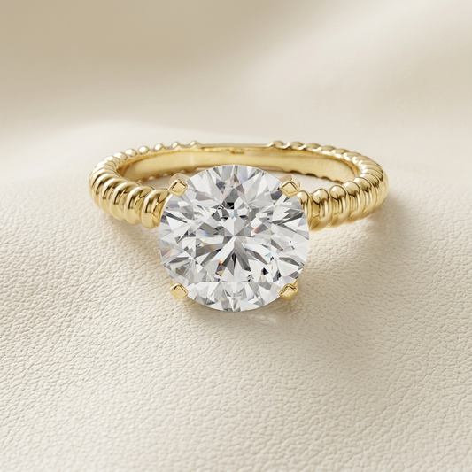 Round solitaire gold ring
Ribbed gold diamond ring
Yellow gold solitaire ring
Round diamond engagement ring
Gold textured band ring
Classic solitaire diamond ring
Elegant gold diamond ring
Luxury solitaire ring
Gold ring with round diamond
Textured gold engagement ring