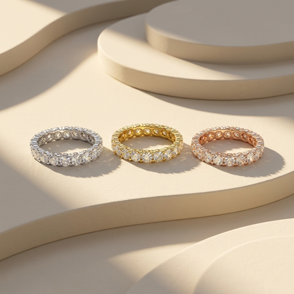 White yellow and rose gold bands with continuous round diamond rows
Three eternity bands featuring closely arranged brilliant diamonds
Tricolor gold bands showcasing uninterrupted circular stone settings
Sparkling diamond bands displayed in three polished gold finishes
Coordinated eternity bands with luminous round cut diamond sequences
Fine jewelry band trio featuring full circle diamond arrangements
Radiant mixed gold bands with repeating brilliant stone details
Classic diamond eternity bands casting soft