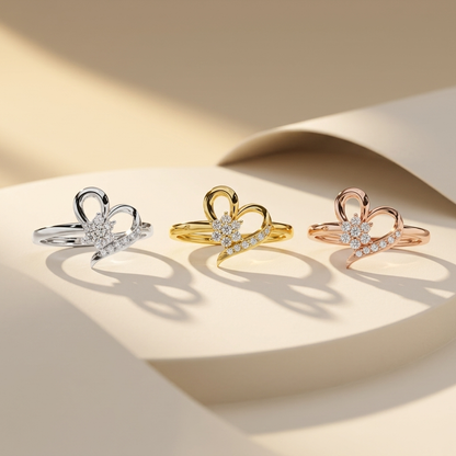 White yellow and rose gold heart rings with floral diamond centers
Three open heart rings featuring sparkling flower shaped clusters
Tricolor gold rings with graceful pavé diamond sweep accents
Sculpted heart silhouettes framing radiant diamond blossom motifs
Elegant mixed gold rings combining floral details and flowing curves
Diamond flower centerpieces enhanced by shimmering curved stone rows
Artistic heart ring trio displayed in three polished gold finishes
Delicate botanical diamond rings with asymmetri