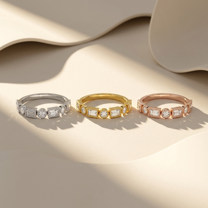 White yellow and rose gold bands with alternating emerald and round diamonds
Three mixed cut diamond bands featuring detailed beaded frame settings
Tricolor gold bands with geometric rectangular and circular diamond motifs
Elegant diamond bands showcasing alternating stone shapes in structured panels
Brilliant emerald cut and round diamonds arranged across three gold finishes
Fine jewelry band trio with ornate milgrain inspired diamond borders
Refined mixed gold bands featuring individually framed brilliant