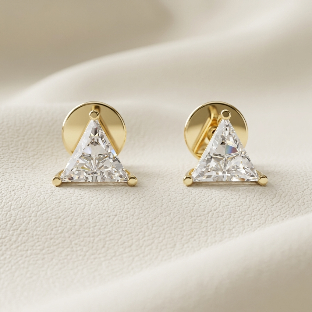 Yellow gold trillion cut diamond stud earrings featuring brilliant triangular solitaire diamonds.
Elegant trillion cut diamond stud earrings crafted in polished yellow gold.
Luxury yellow gold triangular diamond stud earrings with a classic three-prong setting.
Fine jewelry trillion cut diamond studs showcasing brilliant geometric diamonds.
Contemporary yellow gold trillion diamond earrings with exceptional brilliance.
Premium triangular solitaire diamond stud earrings designed in polished yellow gold.
Desi