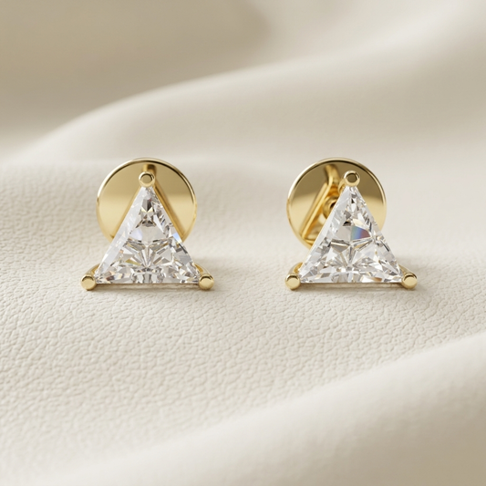 Yellow gold trillion cut diamond stud earrings featuring brilliant triangular solitaire diamonds.
Elegant trillion cut diamond stud earrings crafted in polished yellow gold.
Luxury yellow gold triangular diamond stud earrings with a classic three-prong setting.
Fine jewelry trillion cut diamond studs showcasing brilliant geometric diamonds.
Contemporary yellow gold trillion diamond earrings with exceptional brilliance.
Premium triangular solitaire diamond stud earrings designed in polished yellow gold.
Desi