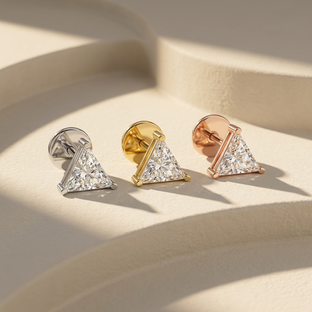 Trillion cut diamond stud earrings available in white, yellow, and rose gold finishes.
Luxury trillion cut diamond stud earrings crafted in white, yellow, and rose gold.
Elegant triangular diamond stud earrings showcased in three premium gold tones.
Fine jewelry trillion cut diamond studs featuring brilliant triangular diamonds in three gold finishes.
Contemporary trillion cut diamond earrings displayed in white, yellow, and rose gold.
Premium triangular solitaire diamond stud earrings designed in three lux