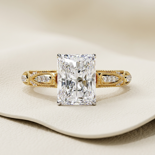 Vintage Radiant Diamond Engagement Ring Design
Radiant Cut Diamond Ring With Milgrain Band
Antique Style Radiant Diamond Gold Ring Design
Radiant Solitaire Ring With Pave Side Details
Elegant Radiant Diamond Ring With Vintage Band
Decorative Radiant Cut Diamond Bridal Ring Style
Radiant Diamond Ring With Intricate Gold Band
Fine Radiant Diamond Ring With Vintage Accents
Classic Radiant Engagement Ring With Pave Design
Luxury Radiant Diamond Ring With Ornate Band