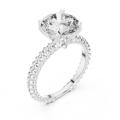 White gold round cut diamond rope band angled view
White gold solitaire ring with rope textured band
Round diamond ring with raised prong setting
Four prong white gold round diamond ring
Angled view of white gold engagement ring
Rope band round brilliant diamond ring
White gold solitaire ring with open basket
Polished white gold round diamond ring
Round diamond ring with textured white band
Classic white gold solitaire rope band ring