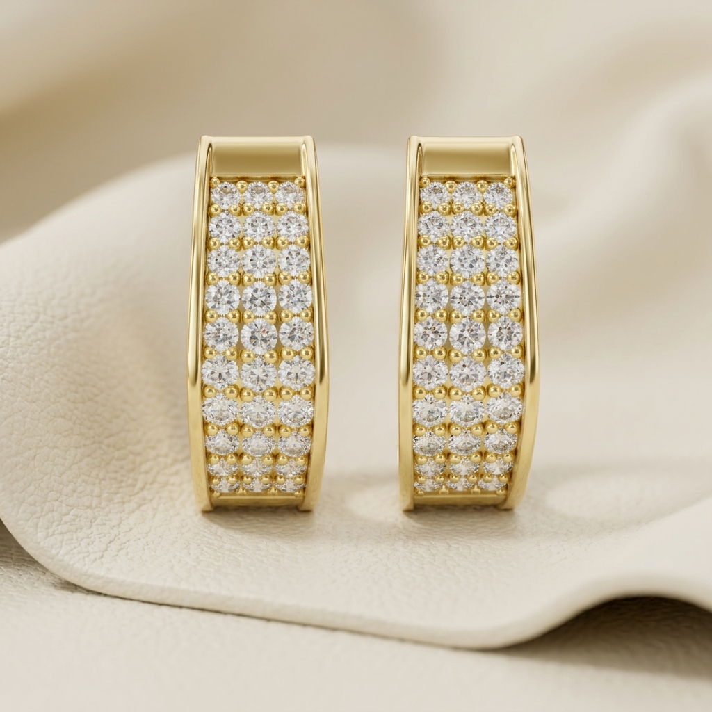 Yellow gold hoop earrings featuring brilliant multi-row pavé-set diamonds.
Elegant yellow gold diamond hoop earrings with a timeless luxury design.
Fine jewelry yellow gold hoops adorned with sparkling round diamonds.
Luxury pavé diamond hoop earrings crafted in polished yellow gold.
Contemporary yellow gold earrings showcasing dazzling pavé diamond detailing.
Premium yellow gold hoop earrings with brilliant diamond accents.
Designer yellow gold diamond hoops combining elegance and everyday style.
Handcraft