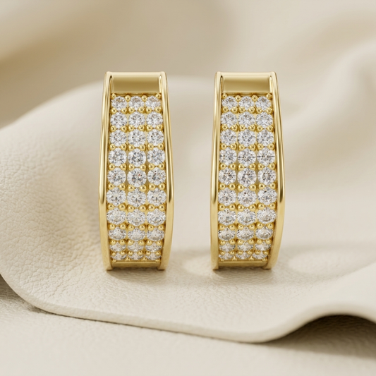 Yellow gold hoop earrings featuring brilliant multi-row pavé-set diamonds.
Elegant yellow gold diamond hoop earrings with a timeless luxury design.
Fine jewelry yellow gold hoops adorned with sparkling round diamonds.
Luxury pavé diamond hoop earrings crafted in polished yellow gold.
Contemporary yellow gold earrings showcasing dazzling pavé diamond detailing.
Premium yellow gold hoop earrings with brilliant diamond accents.
Designer yellow gold diamond hoops combining elegance and everyday style.
Handcraft