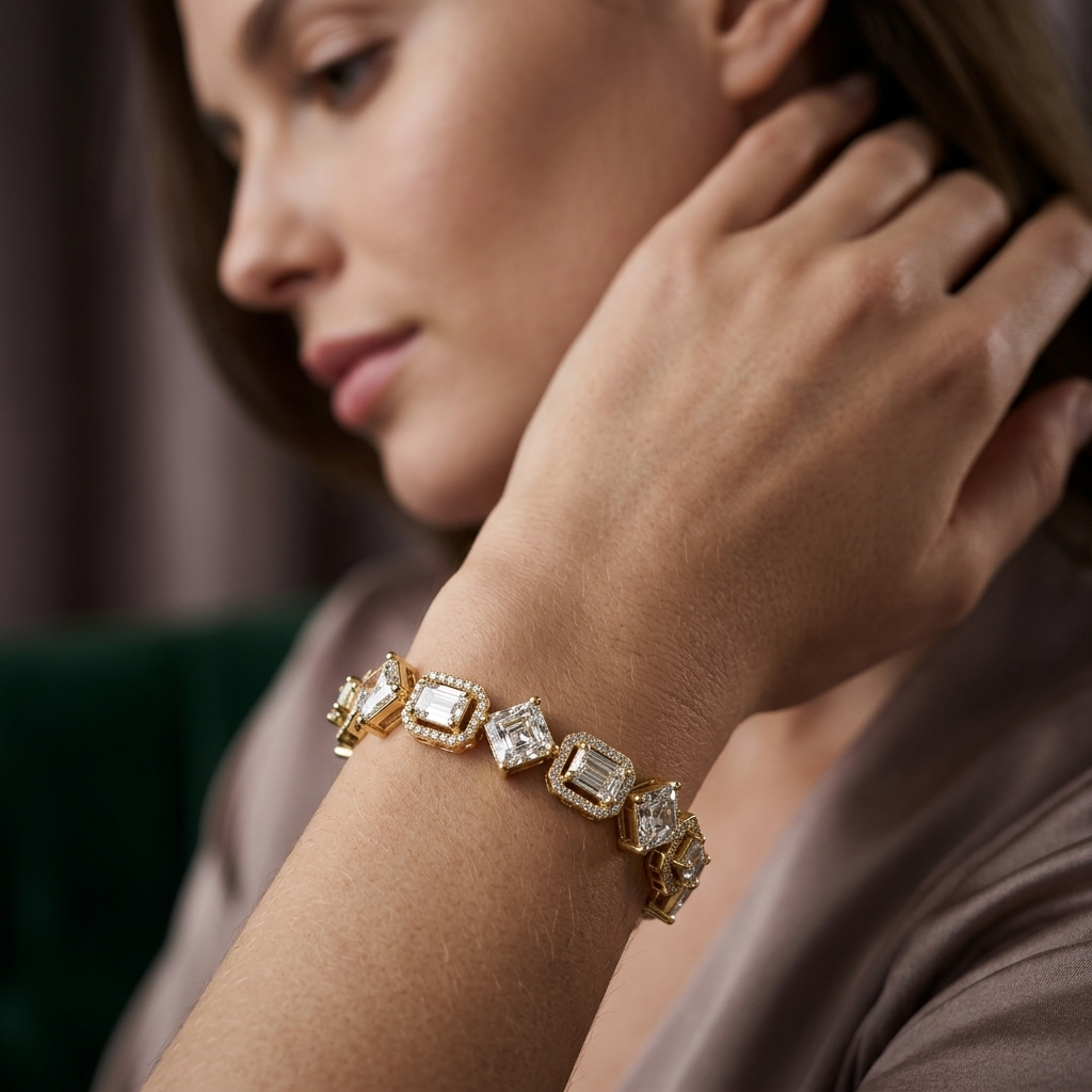 Luxury geometric bracelet with halo-accented emerald and radiant lab grown diamonds.
